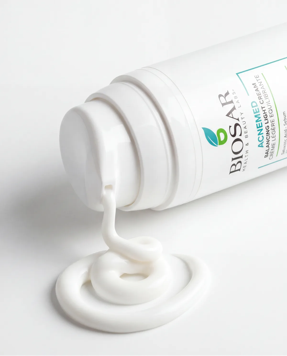 Close-up of BIOSAR Acnemed cream texture and bottle